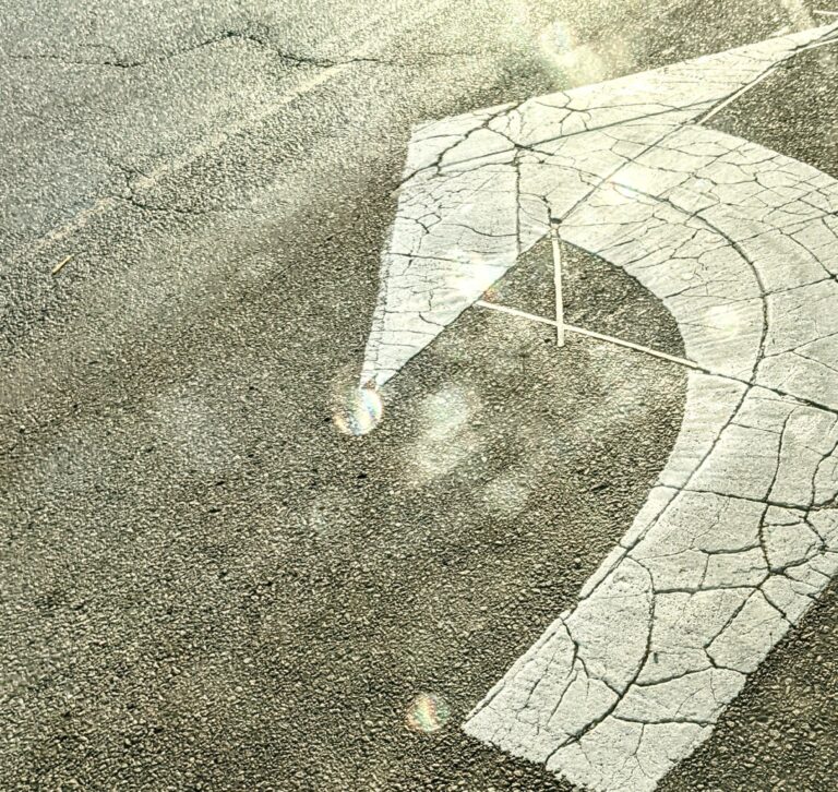 Left turn only sign on the road